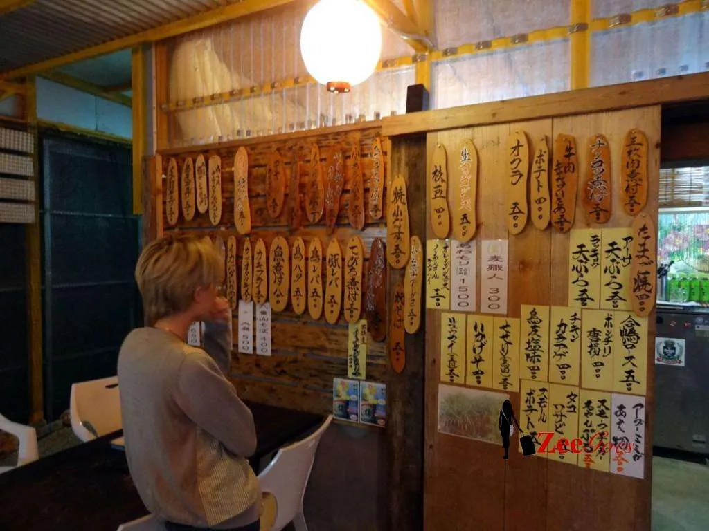 'alan' trying to understand the menu. Yup, that there on the wall is the menu