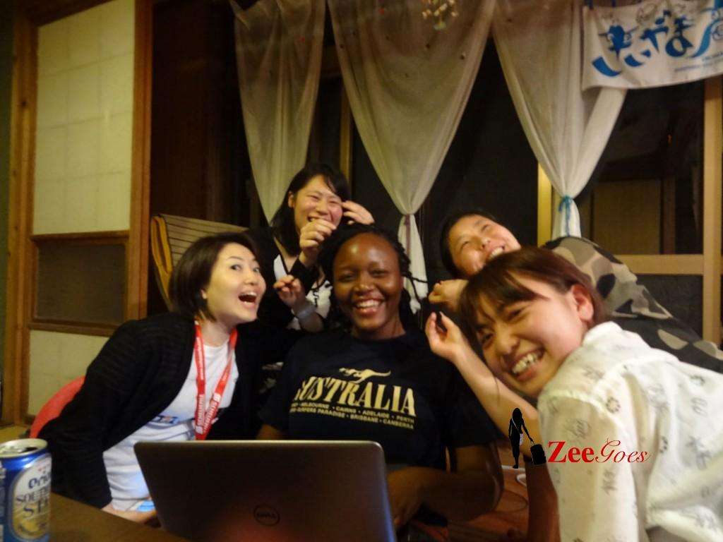 Playing with my hair while I blog (my housemates, Japanese tourists)